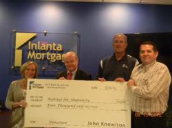 Habitat for Humanity of Waukesha County representatives meet with Inlanta Mortgage to collect $4,000 donation.